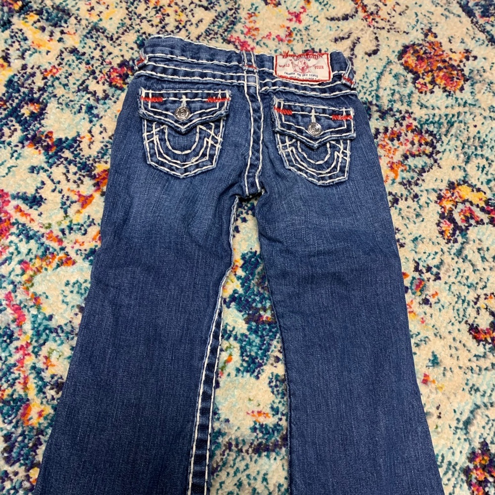 Kids true religion jeans like new. Boys.  Not sure by it says girls.
